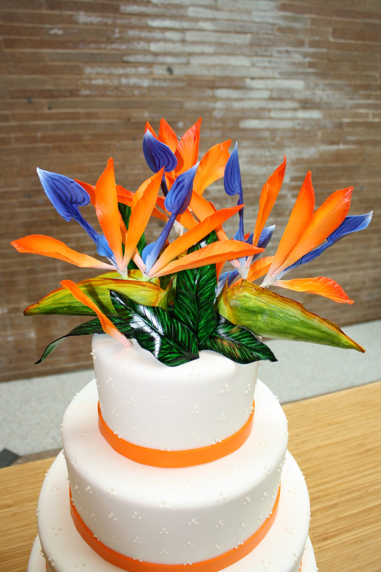 Wedding cake with sugar bird of paradise flowers